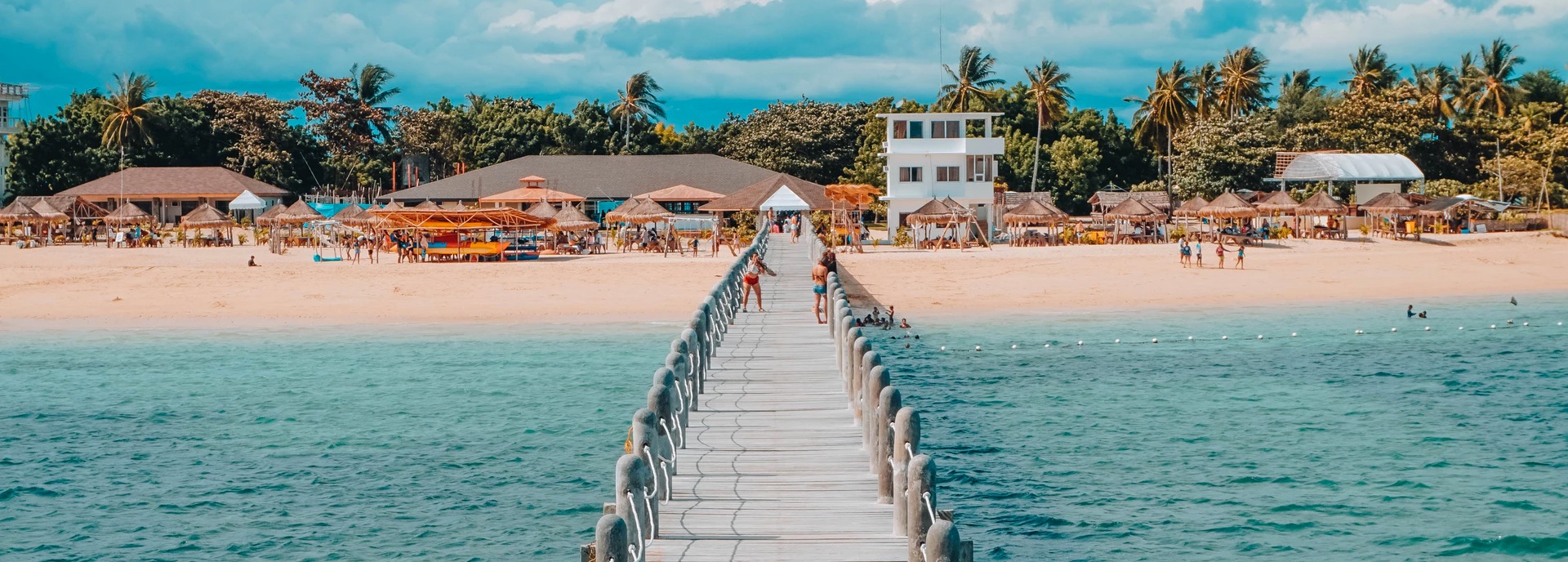 Picture of tropical beach with a long bridge
